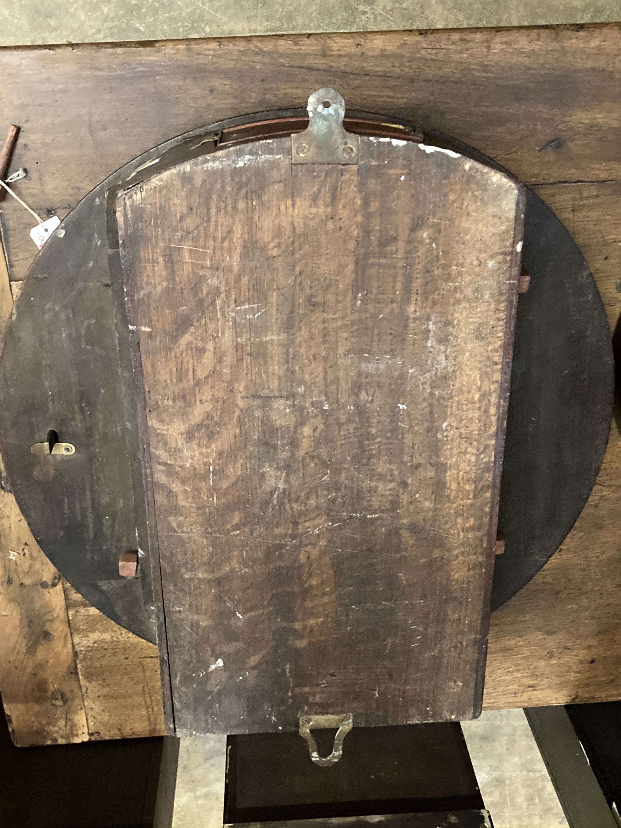 A large British Rail mahogany wall clock case, lacking movement, stamped 191SW, Diameter 57cm.